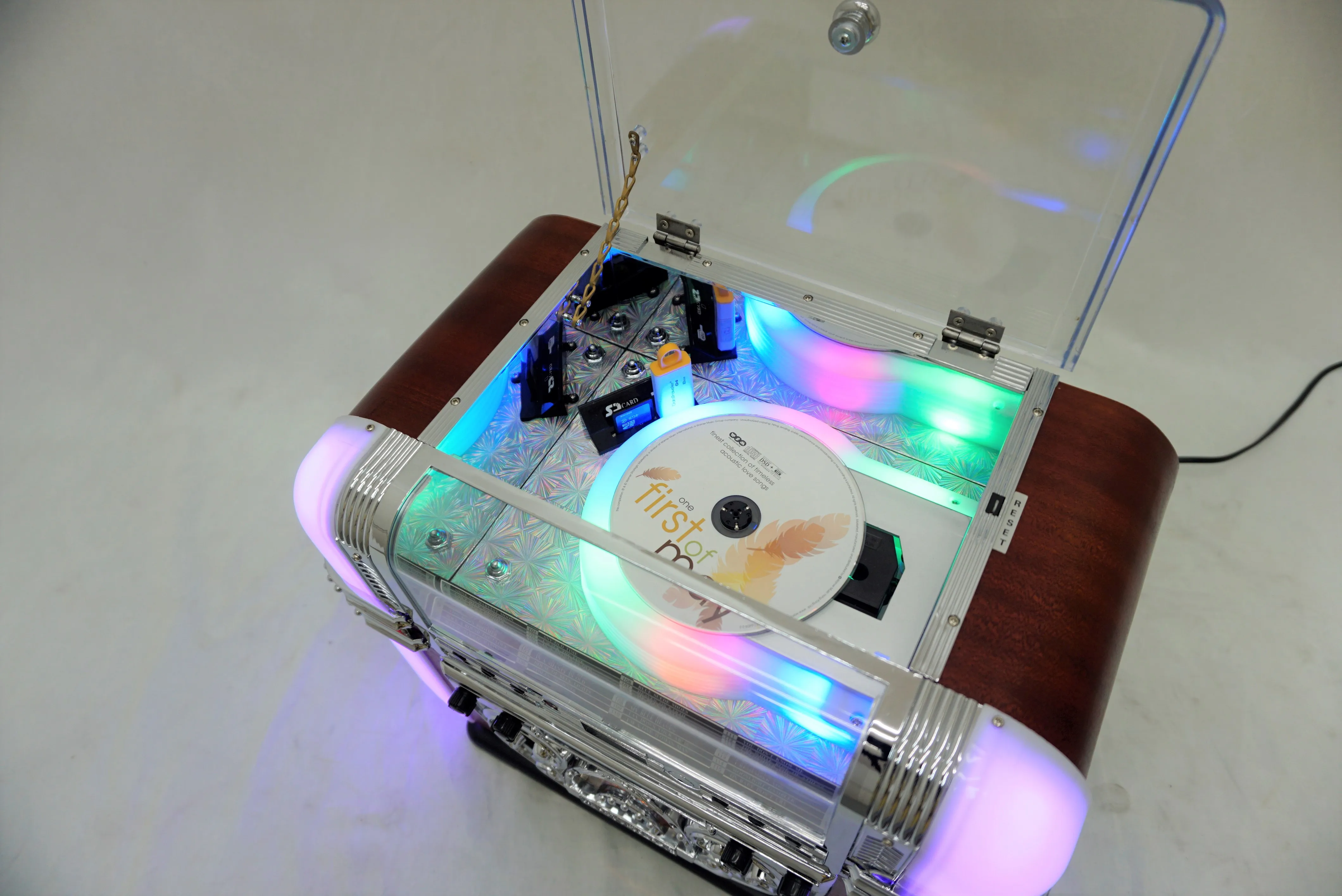 The tabletop jukebox features a rounded rectangular design, allowing for customizable colors and lights