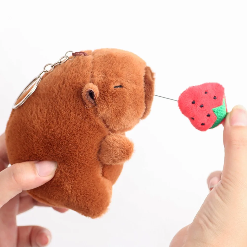 LLavero de capibara de peluche Kawaii, colgante de capibara de simulación de dibujos animados de 12cm, colgante de bolso escolar para tirar de mocos