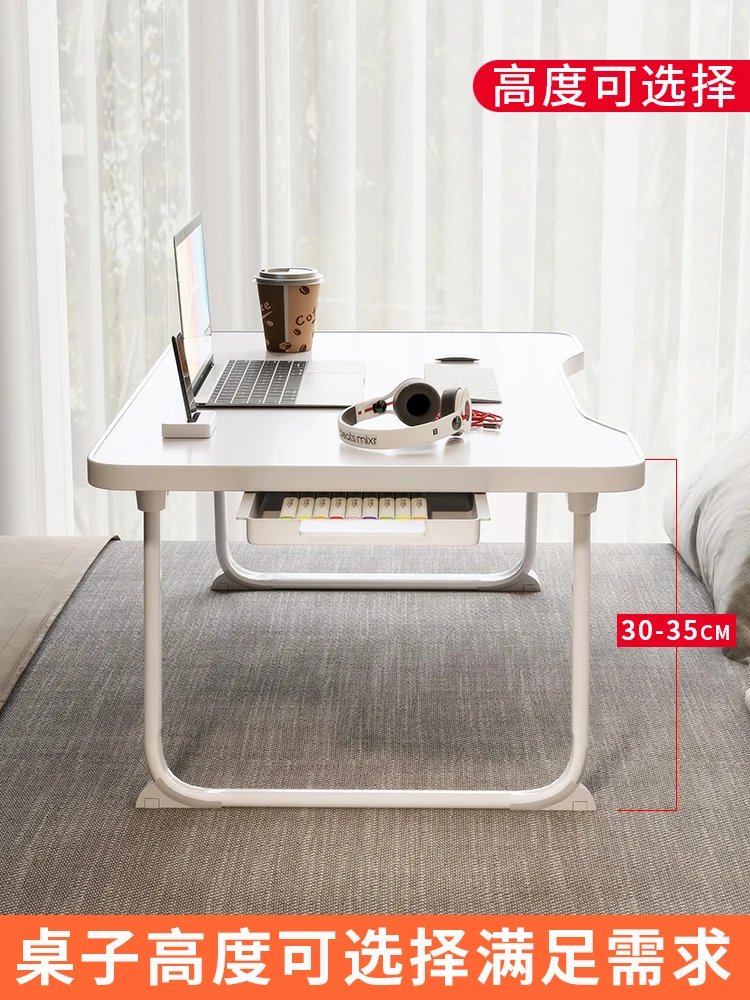 Small writing table, laptop, lazy table, student sitting on the floor, folding study desk