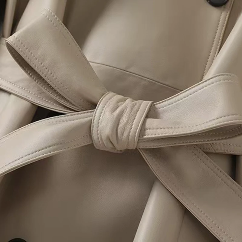 Giacca da donna in vera pelle Autunno Inverno Stile coreano Vestibilità ampia Pelle di pecora Cintura doppiopetto Trench casual di media lunghezza