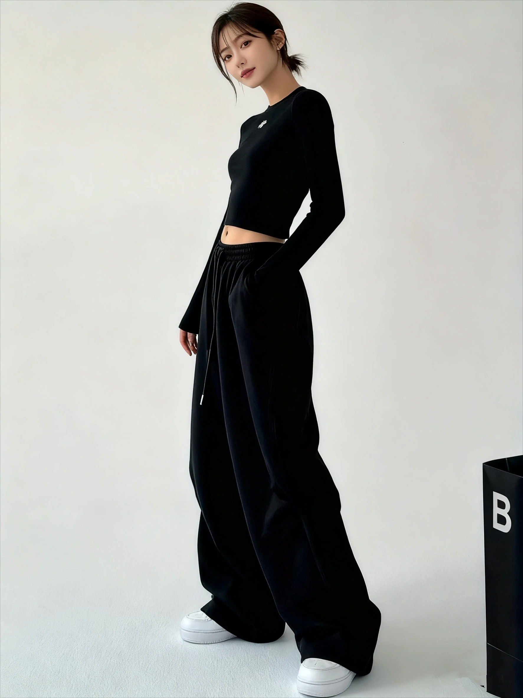 กางเกงขายาวทรงหลวมสีดำล้วนสำหรับผู้หญิง มีกระเป๋า สไตล์ลำลอง