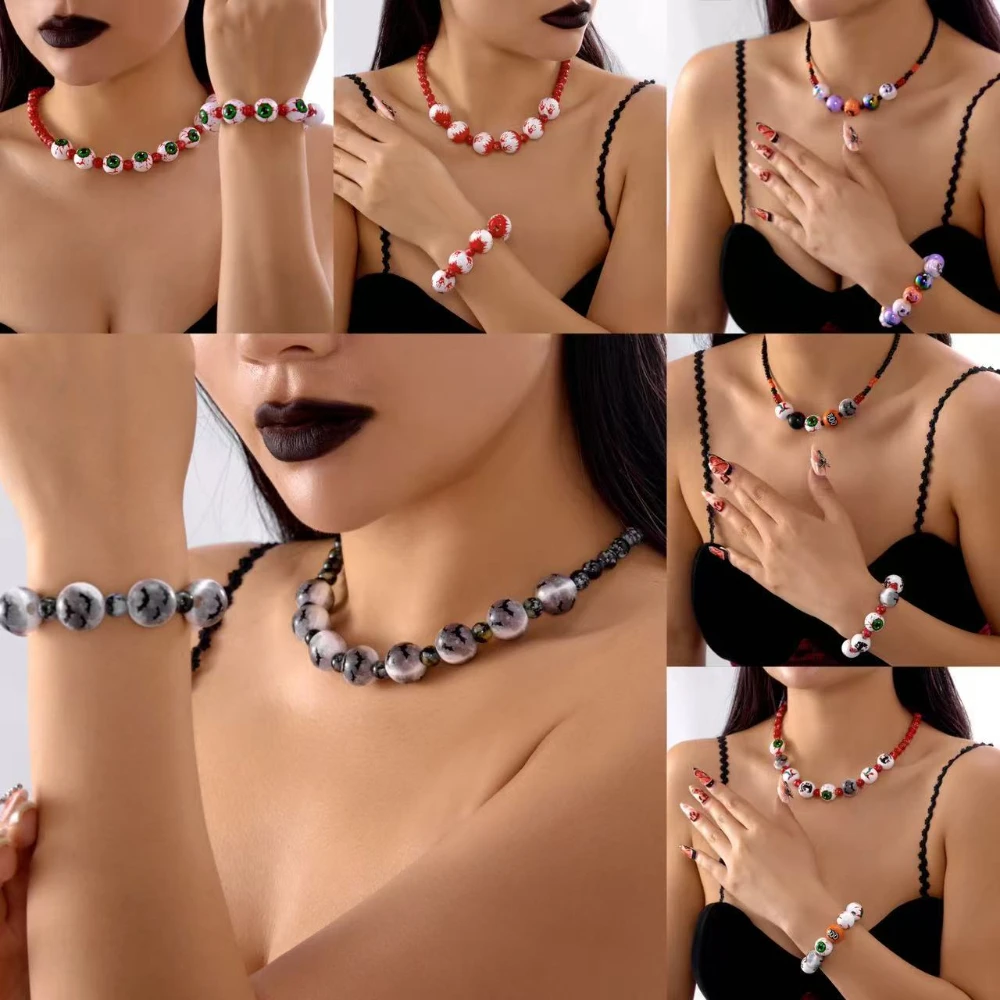 

Dark Gothic Halloween series - necklace and bracelet with wooden beads featuring a bloody hand, bat, and ghost prints