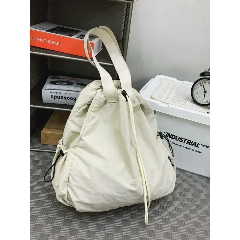 Simples Sólida Corda Dobras Saco de Escola Nylon, Alta Capacidade, Mochilas Versáteis, Moda Unisex, Shoulder Bags, Venda Quente, 2024