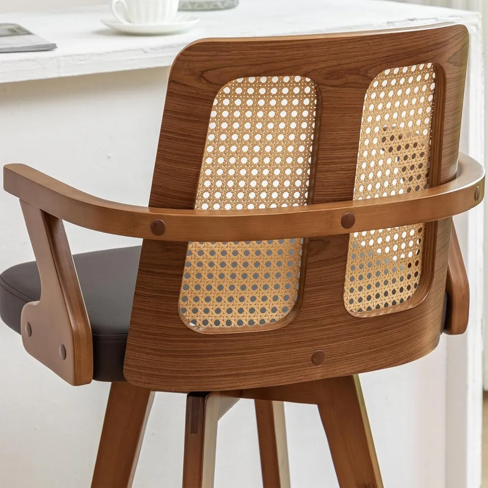 27 مقعد مرتفع دوار من خشب الجوز مع مقعد منجد، ظهر قصب، أذرع منحنية، جلد صناعي