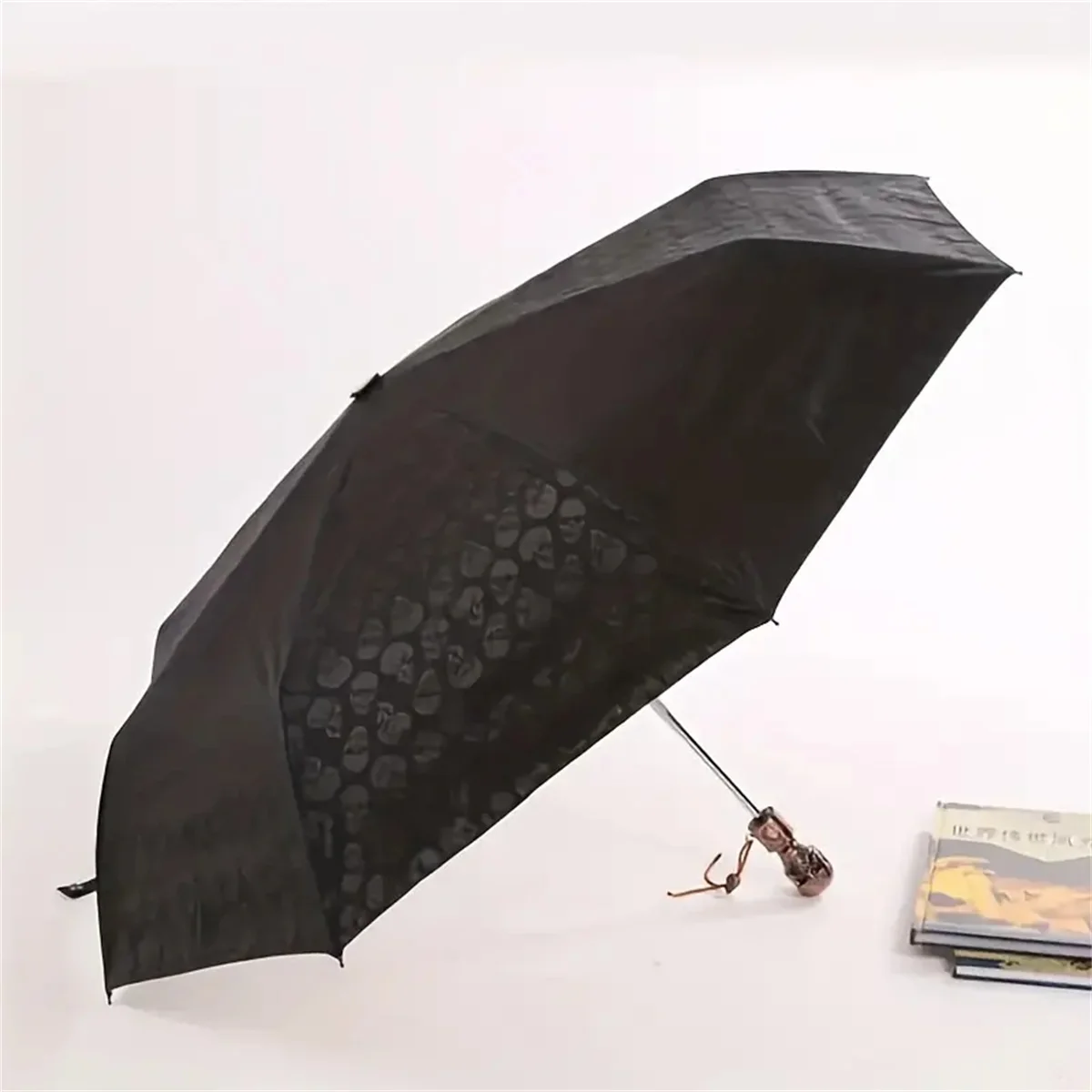 Creative skull head fully automatic tri-fold umbrella UV protection sunny and rainy umbrella windproof sunshade men and women su