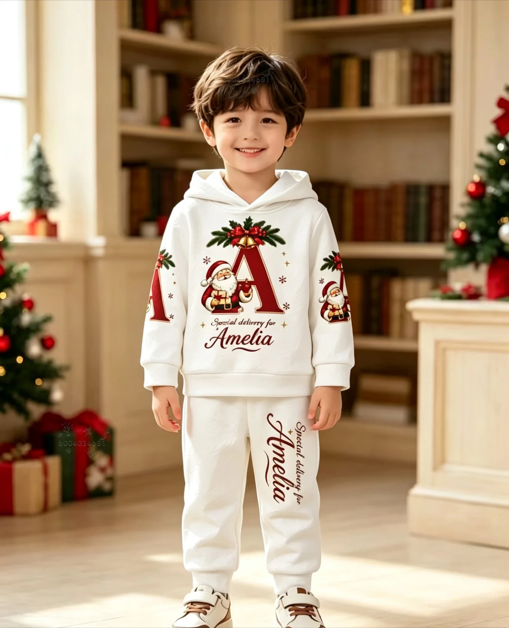 A casual two-piece Christmas outfit for children,featuring a hoodie and sweatpantsadorned withlettering andSanta Claus graphics.