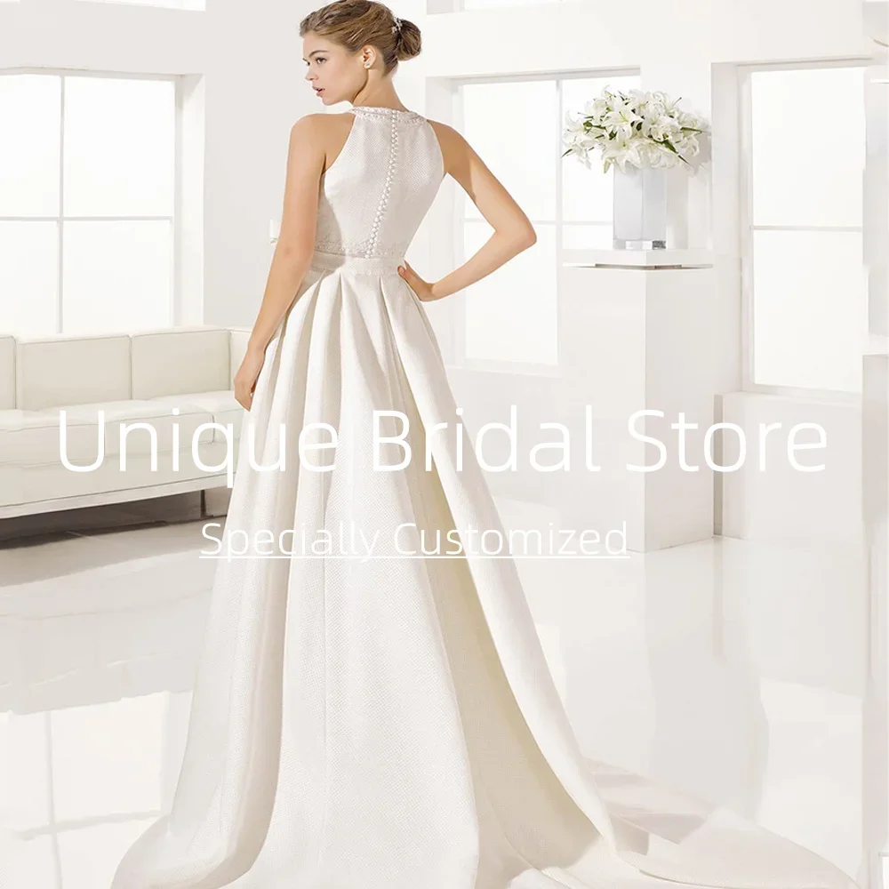 カスタマイズされたシンプルなウェディングドレスエレガントな滑らかな A ラインスイープトレインノースリーブバックボタン高品質の女性の新しいブライダル
