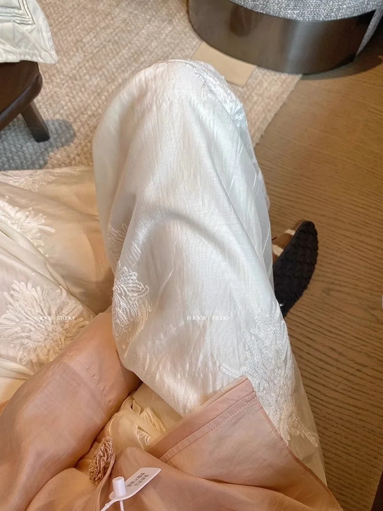 Pantaloni a gamba larga ricamati bianchi Pantaloni estivi larghi dal taglio dritto da donna Nuovi pantaloni casual cinesi Sle Pendolari Sle
