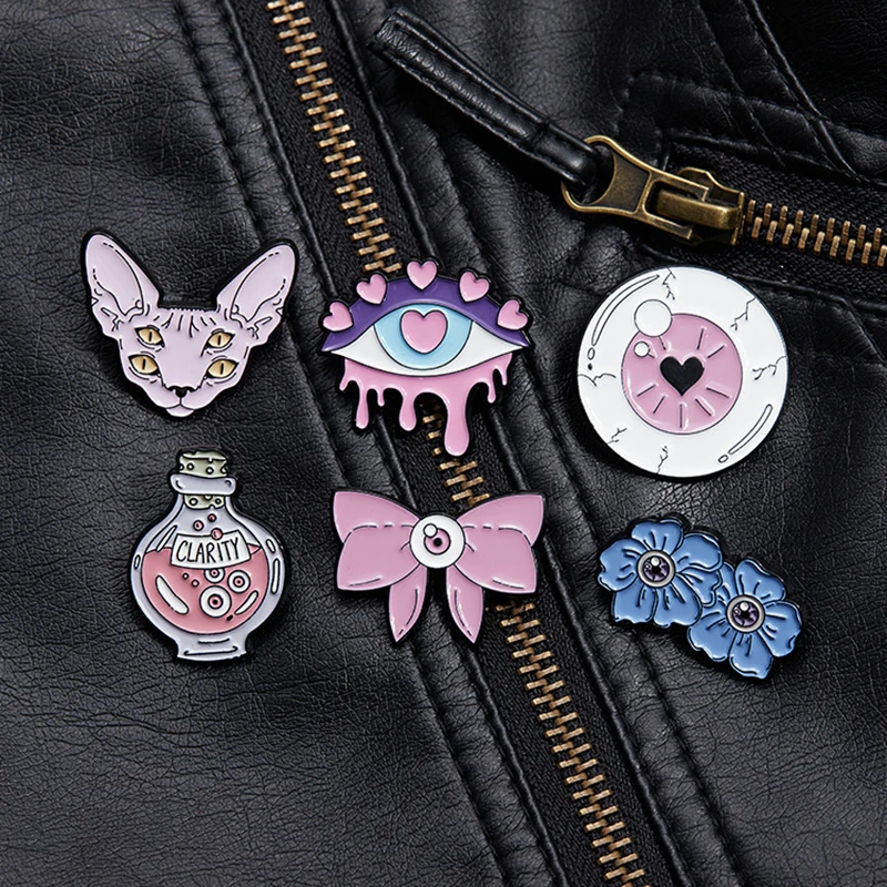 Lindo broche de ojo rosa arco gato amor ojo flor azul claridad pociones ojo creativo Metal insignia Punk solapa Pin joyería accesorio regalo