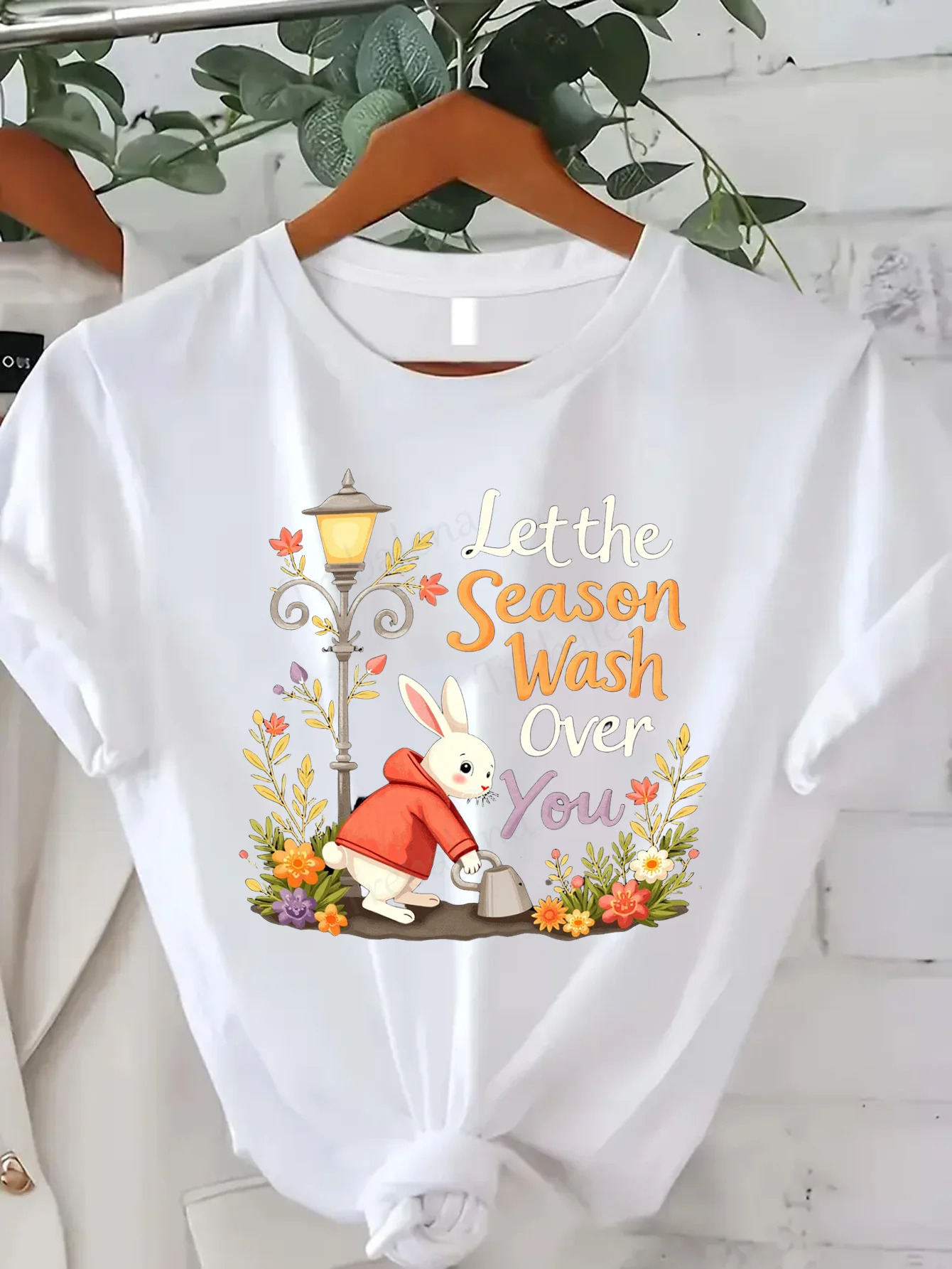 

Comfortable Women's Print T-shirt "Spring Bunny Gardening T-Shirt - 'Let the Season Wash Over You' Graphic Tee"
