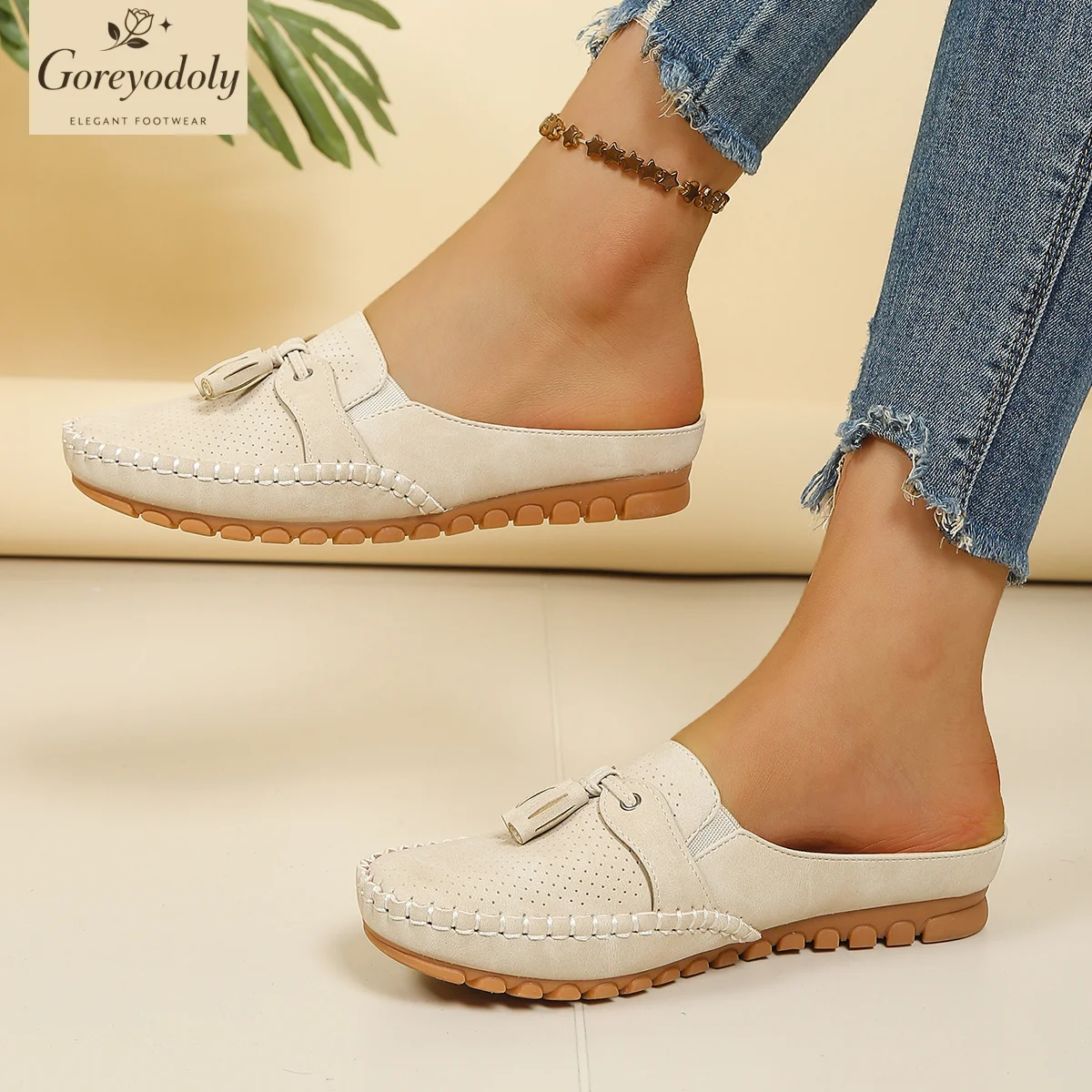 Goreyodoly women mule flats perforated pattern tassel detail elastic slip on wide fit lightweight soft sole comfort shoes
