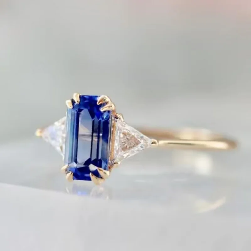 Rectangular Blue Zircon Three Stone Ring with Triangular Cutting Design on Both Sides, Trendy and Luxurious Commuting Jewelry