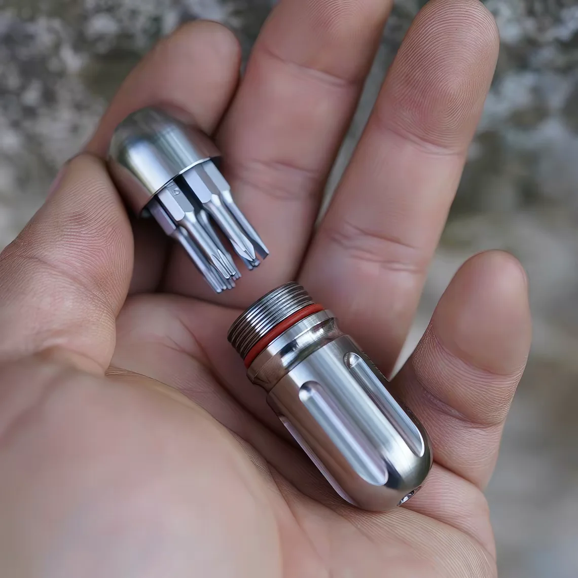 

Titanium alloy EDC multifunctional outdoor tool, portable screwdriver with drill bit, waterproof medicine box keychain