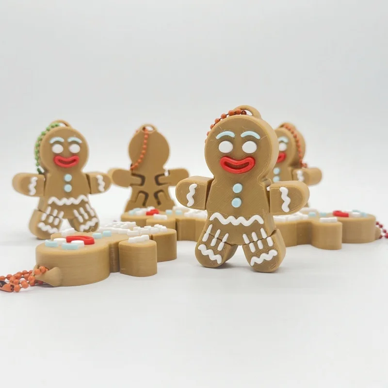 A gingerbread man pendant, suitable for hanging on a backpack or keychain