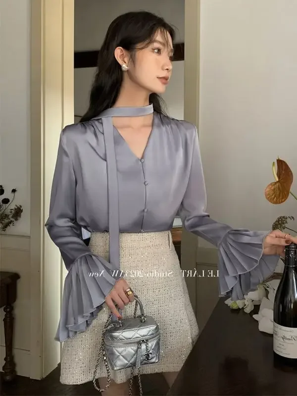 Nuovo design di nicchia Top in raso Camicia ampia e versatile Camicia a nastro con maniche a fisarmonica delicata per le donne all'inizio della primavera