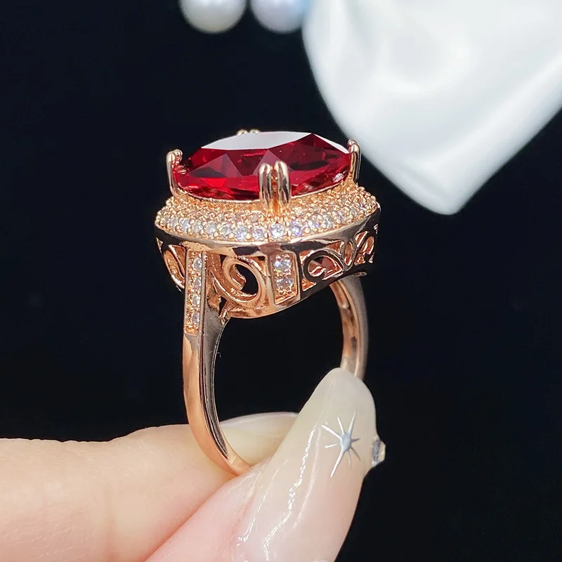 Luxurious diamond-set imitation ruby engagement ring in 925 sterling silver finish, paired with 18K rose gold jewelry gift.