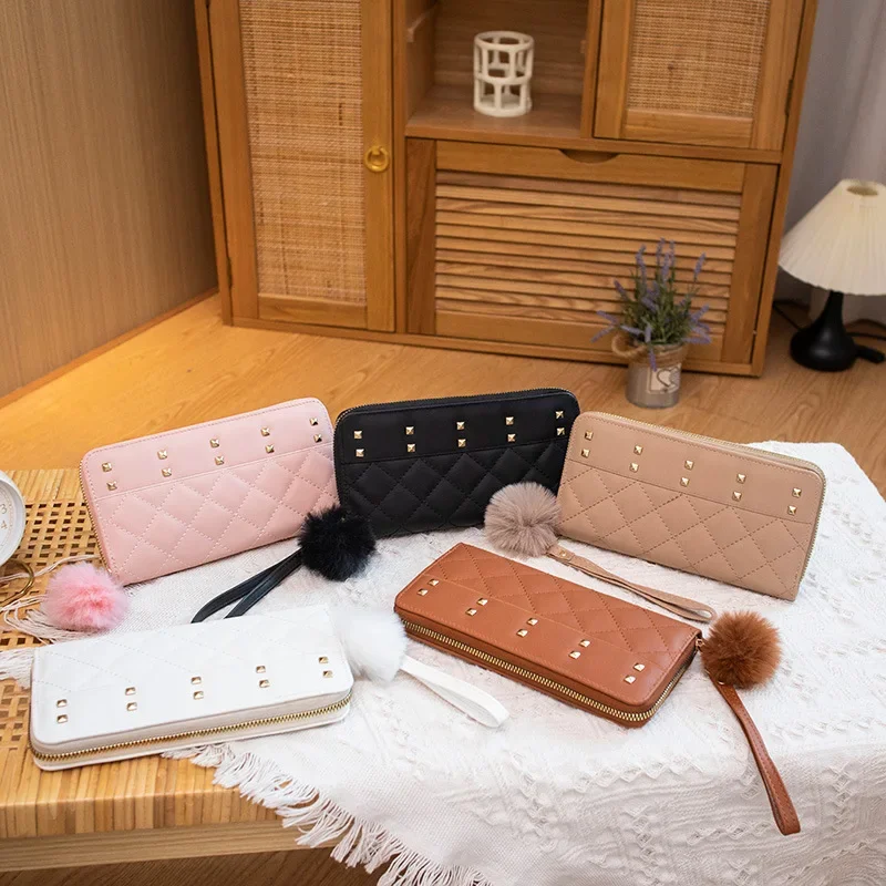 Korean version fashion niche design with diamond pattern embroidery, rivet and fur ball decoration, long multi card zero wallet