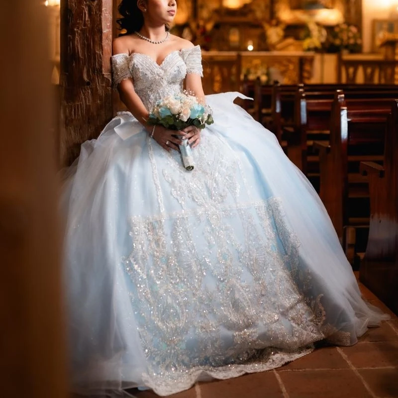 

Sky Blue Shiny Ball Gown Quinceanera Dresses 2026 Applique Lace Beading Crystal Tull Corset Off Shoulder Sweet 16 Dress Years