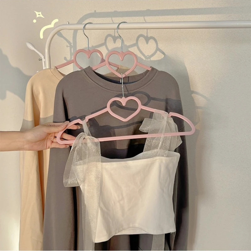 Non-slip Bow Hanger with Heart Design, No-mark Clothes Storage Rack Organizer for Dorm, Durable Holder for Shop Display.