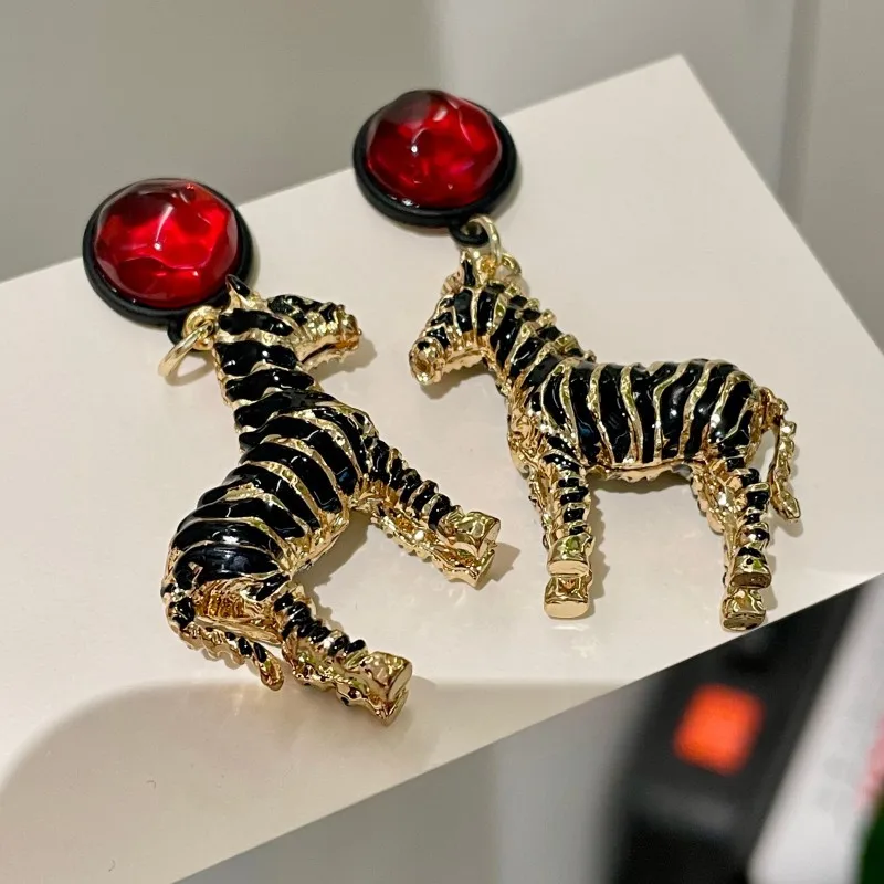Black oil dripping animal pendant earrings