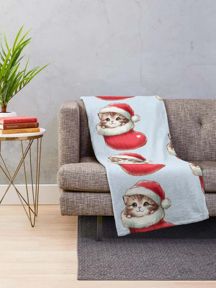 Kitten in a Christmas stocking wearing a Santa hat Throw Blanket Travel Luxury Blankets