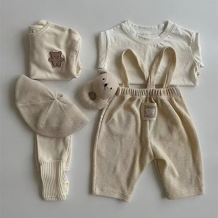 2024 New Infant Cotton Leggings Solid Baby Strap Pants Cute Toddler Waffler Stretch Pants Loose Baby Girl Casual Pants 0-24M