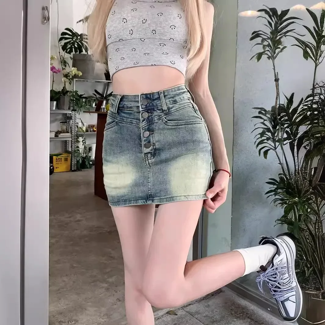 

High-waisted, Design-sense Button-down Denim Skirt. New Summer Fashion Hot Girl Casual Wrap Hip Half Body Skirts for Ladies.