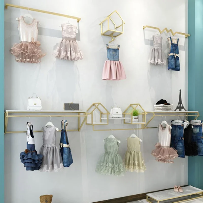 Scaffali appesi personalizzati e a parete espositori per vestiti per bambini scaffale per bambini negozio di abbigliamento Interior Design