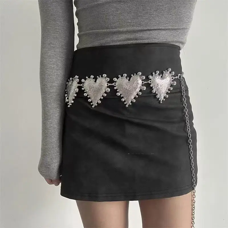 A high-end women's waist chain — a bold metal belt featuring an oversized heart design, adding a unique and stylish touch