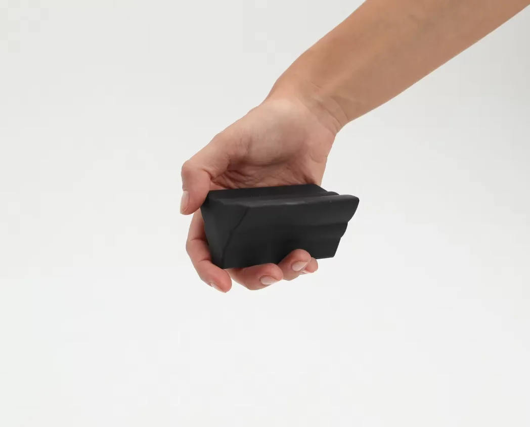 Piriformis muscle relaxation tool, featuring a silicone three-pronged design, designed to help relax deep, sore muscles.