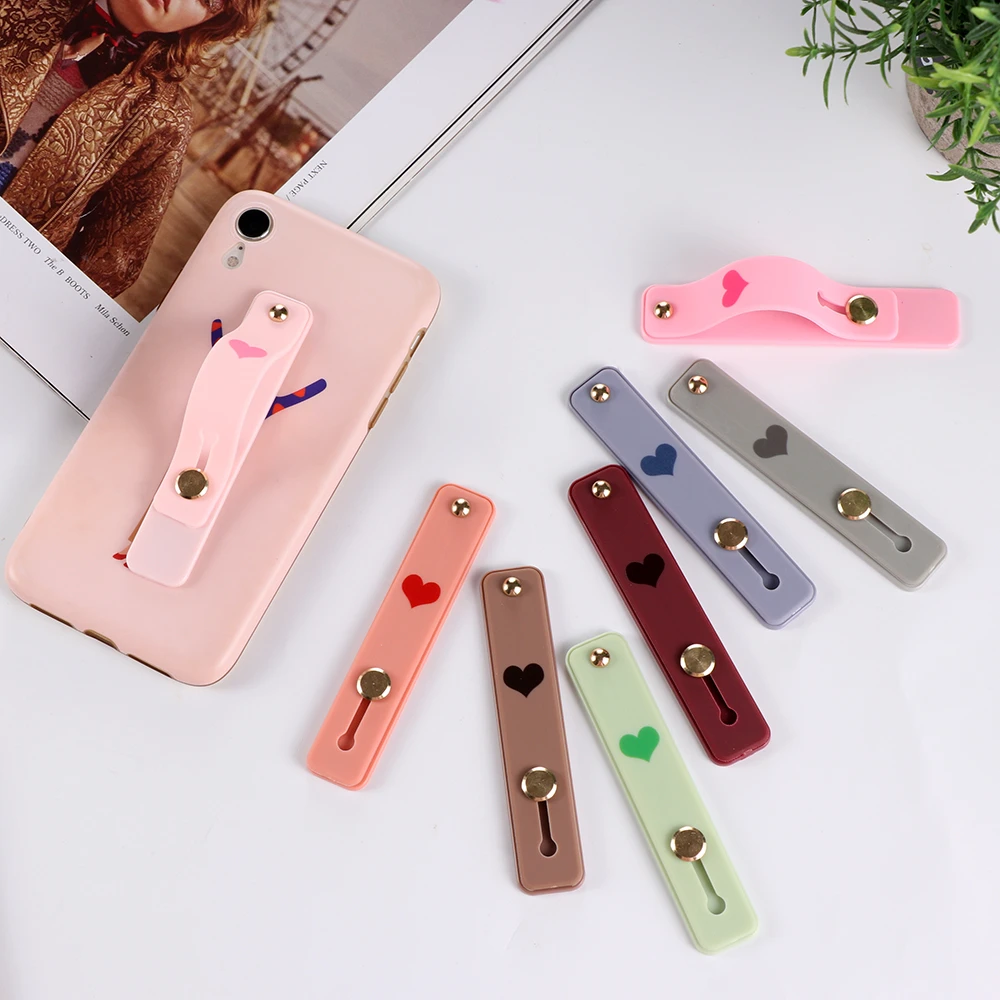 

Universal Silicone Phone Holder Candy Color Push Pull Grip Stretch Stand Phone Finger Strap Wristband Bracket Strap with Stand