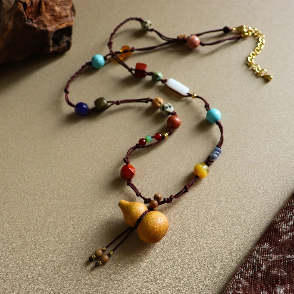 

Autumn and Winter Retro Exquisite Sandalwood Gourd Shape Pendant Turquoise Long Necklace Light Luxury Niche Woven Sweater Chain