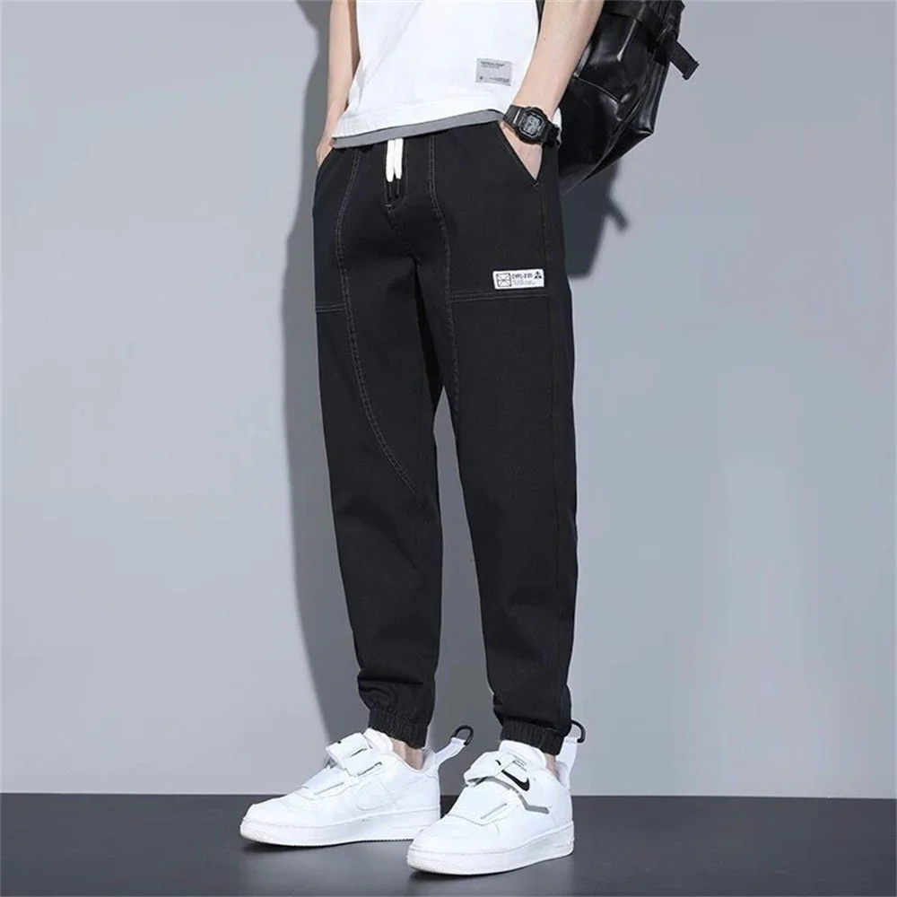 2025 frühling Sommer Lose männer Jeans Text Stickerei Baggy Elastische Taille Harlan Cargo Jogger Hosen Männlich Grau männer jeans harem