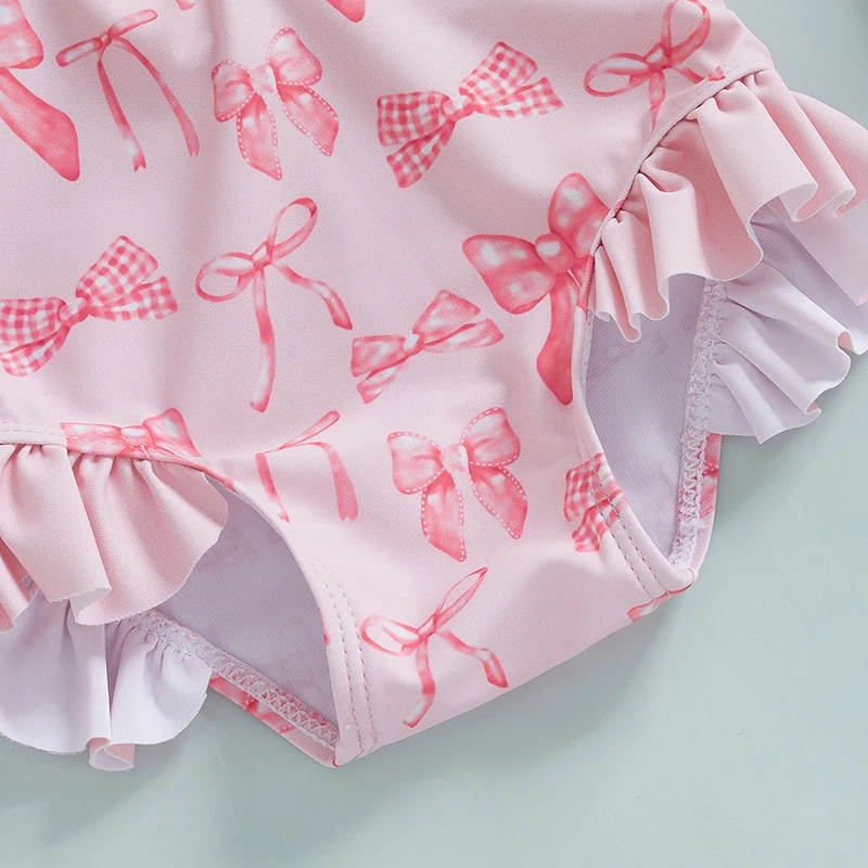 Traje de baño de manga larga para niñas con estampado de lazo y sombrero a juego para diversión en la playa y en la piscina