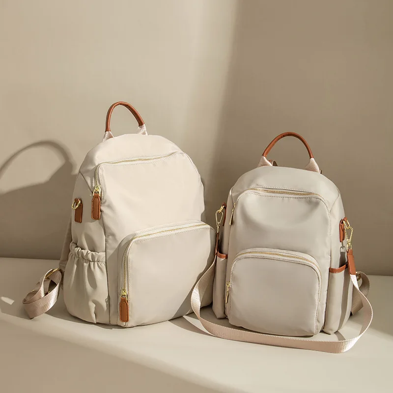 

2025 Four Seasons, новый мужской и женский рюкзак большой вместимости из ткани Оксфорд для отдыха, универсальный пригородный рюкзак, дорожная сумка