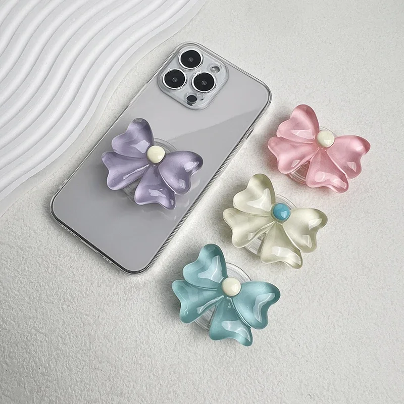 

Cute Socket Talk Grip candy colored bow phone stand Lazy desktop folding stand small fresh bow phone grip