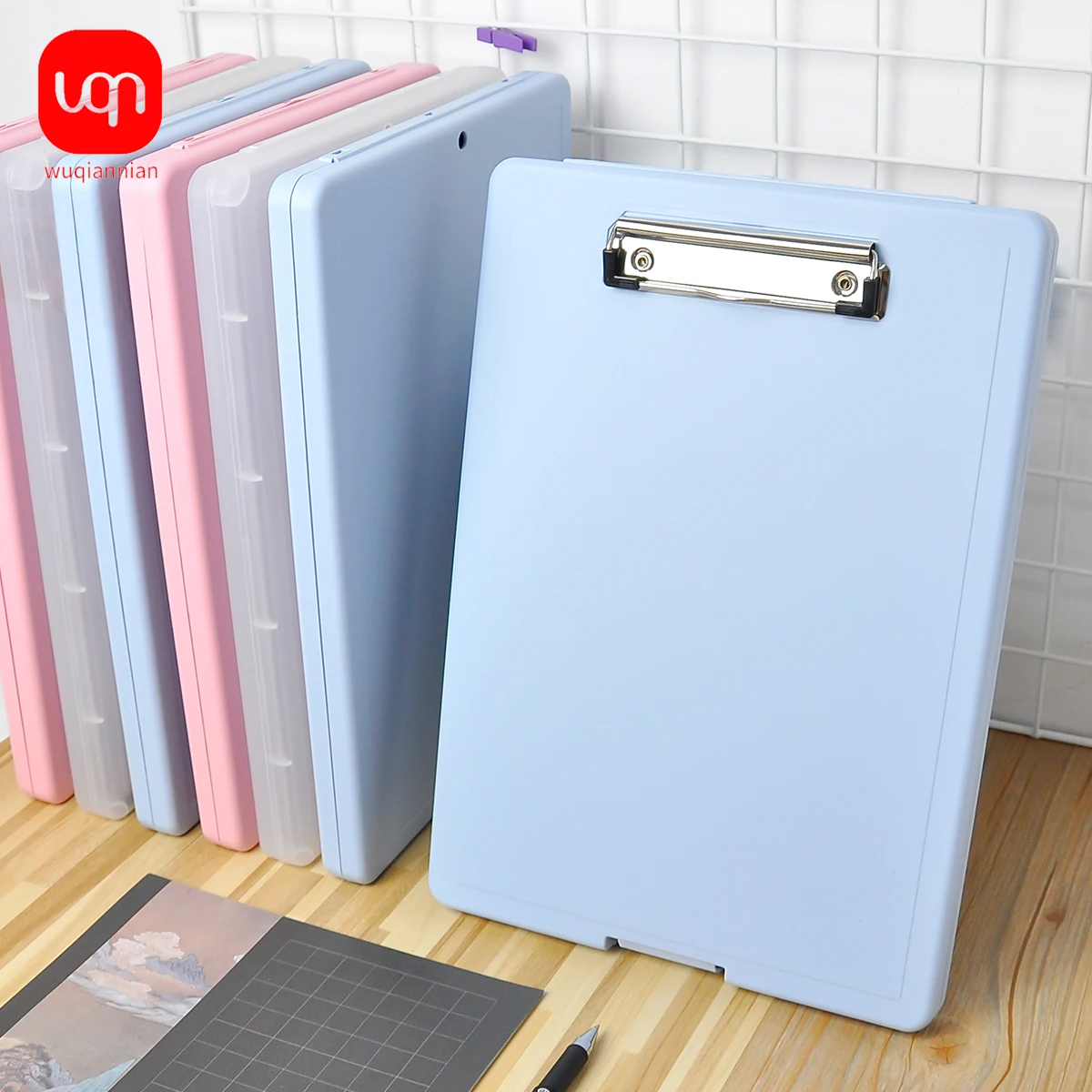 Low-profile clipboard with storage and pen holder for the school corporate office