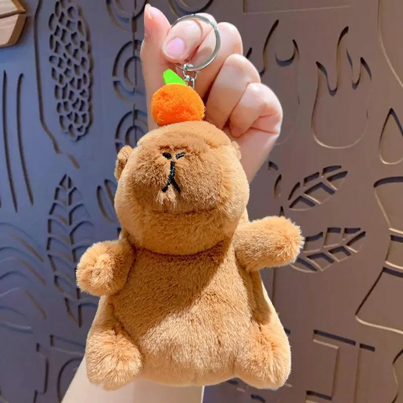 Capybara-colgante de Animal de peluche para niños, llavero de juguete con música creativa, bolso escolar