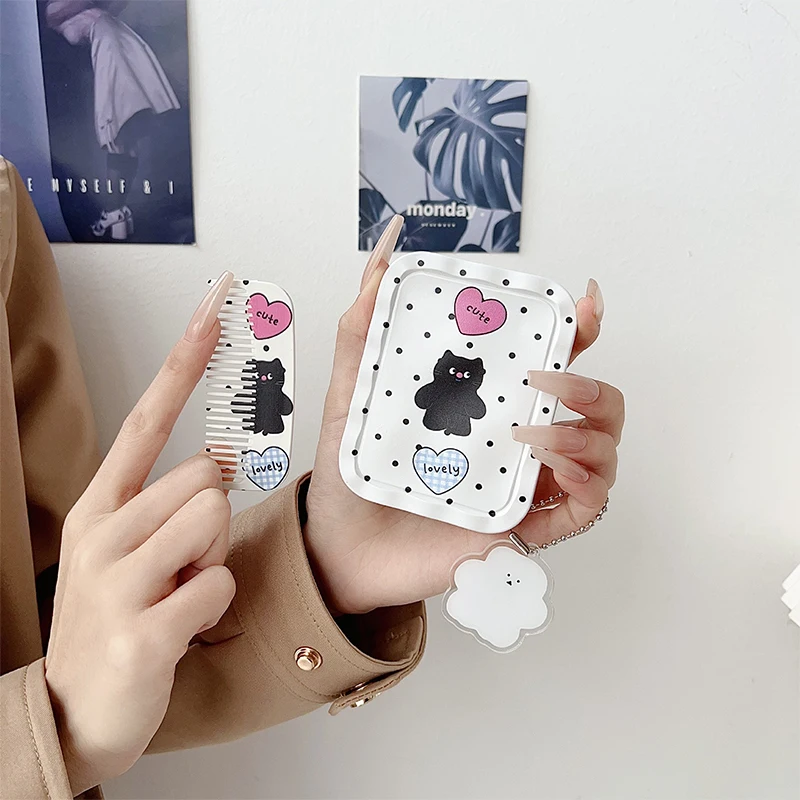 Portable Cartoon-Style Folding Travel Mirror with Built-in Comb – Compact Handheld Makeup Mirror for Women and Girls