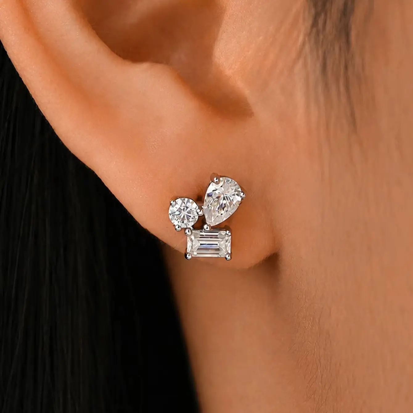 A Pair of 925 Sterling Silver Women's Stud Earrings with A 2.4-Carat Moissanite, Featuring Multiple Cut Designs.