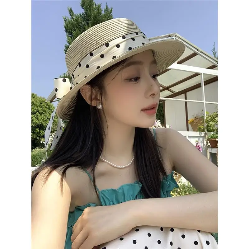 sweet-polka-dot-ribbon-tied-sunshade-straw-hat-women-beach-vacation-style-photography-atmosphere-flat-top-sun-hat