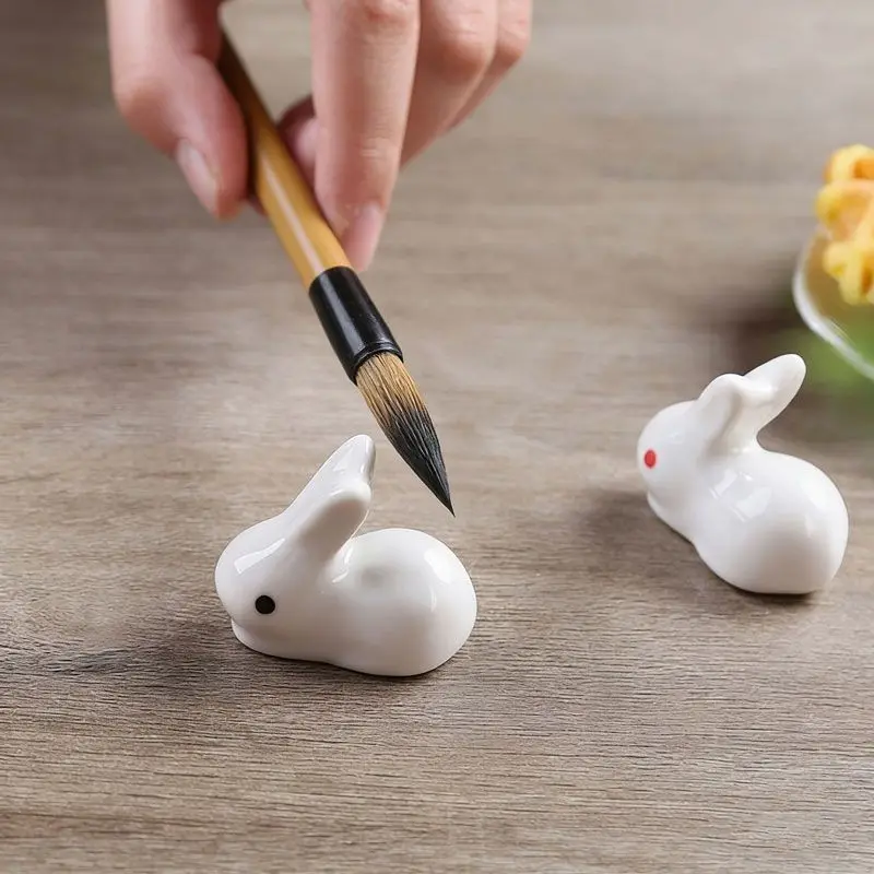 Creative ceramic rabbit shaped brush rest cute ornament for study room paperweight writing brush holder small decor piece