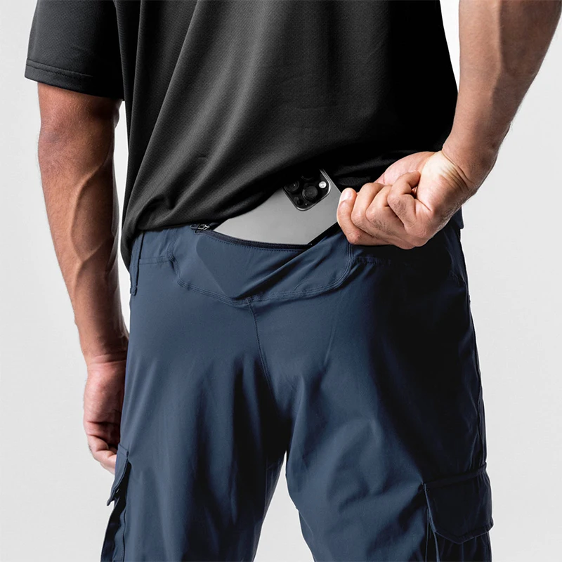 Pantalones deportivos elásticos de secado rápido para hombre, pantalones de entrenamiento deportivos finos y sueltos con bolsillos, ropa de trabajo, diseño 2025