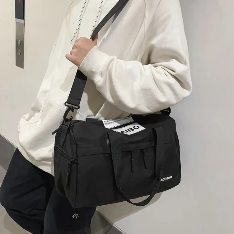 ไนลอนกันน้ํากระเป๋าเดินทางความจุสูงซิปกระเป๋าถือ 2025 ขายร้อน Casual Tote สําหรับ Man Bolsa De Viaje