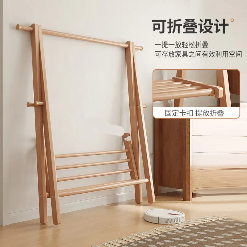 Foldable solid wood coat rack clothes rack floor-to-floor bedroom clothes rack bedside clothes artifact at night.