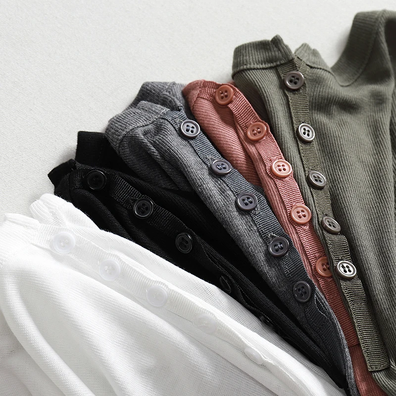 T-shirt Slim con scollo a v profondo in maglia di cotone T-shirt Sexy con bottoni sul davanti Ruffles manica lunga autunno elegante T-shirt da donna See Through