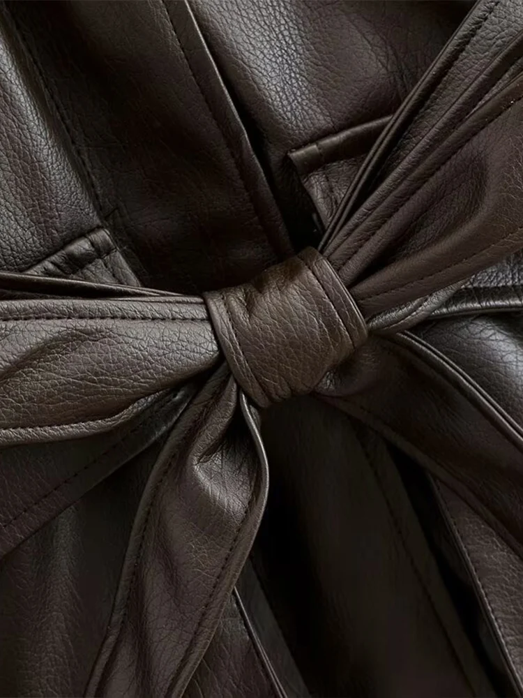 Estilo europeu nova moda feminina versátil temperamento cinto lapela decorativa jaqueta de couro de comprimento médio