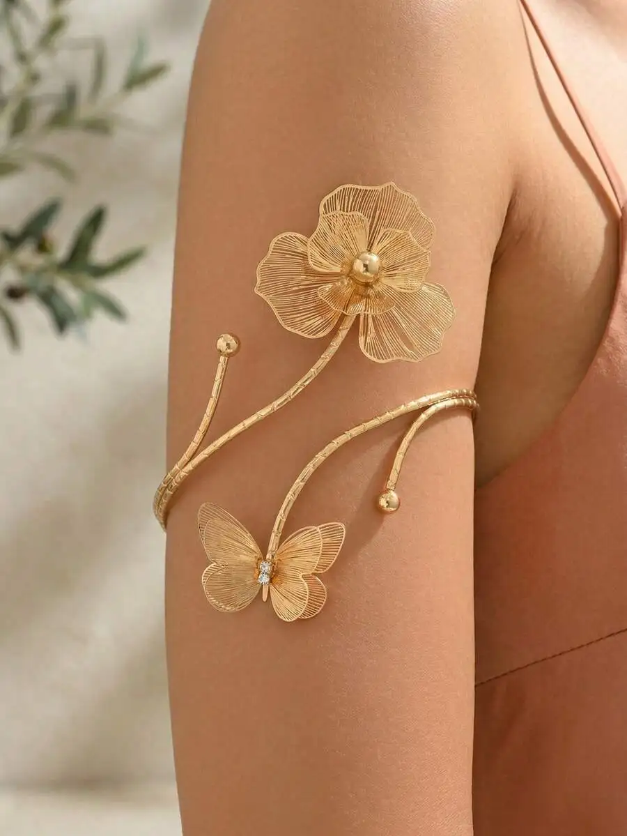

Delicate Gold Filigree Arm Cuff With Floral And Butterfly Motif, Luxury Body Jewelry For Events, Vacations, Studio Shoots