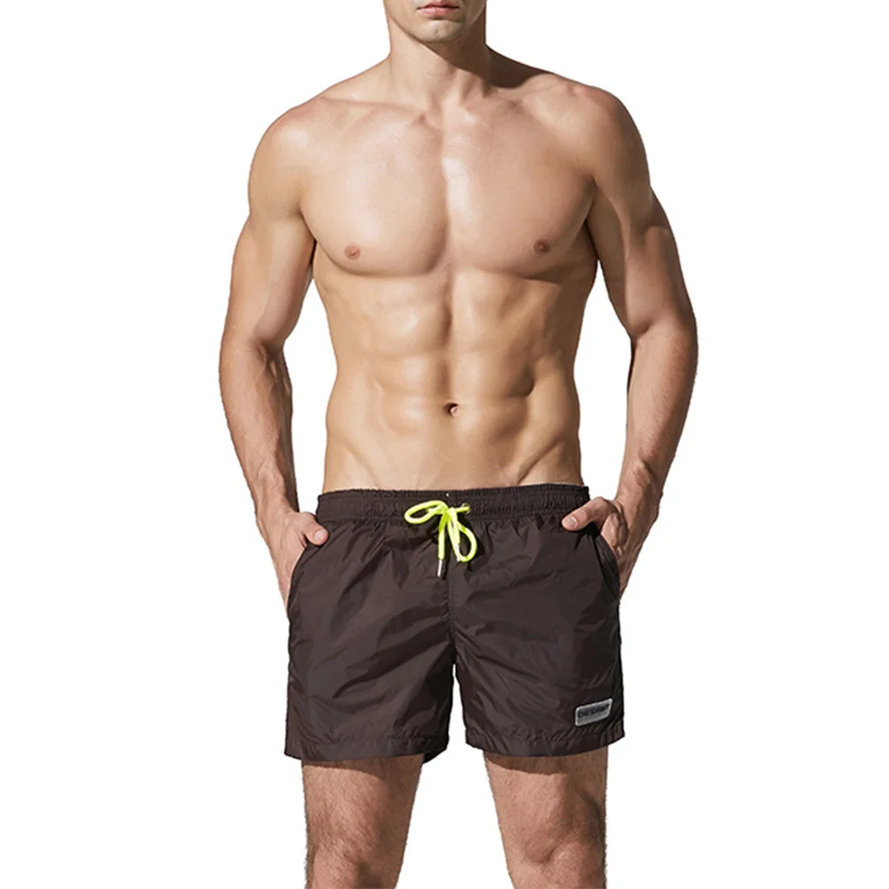 صيف جديد رجالي بلون السراويل الرياضية موضة الاتجاه الترفيه فضفاض بسيط التجفيف السريع تنفس شاطئ البحر عطلة الرجال القاع