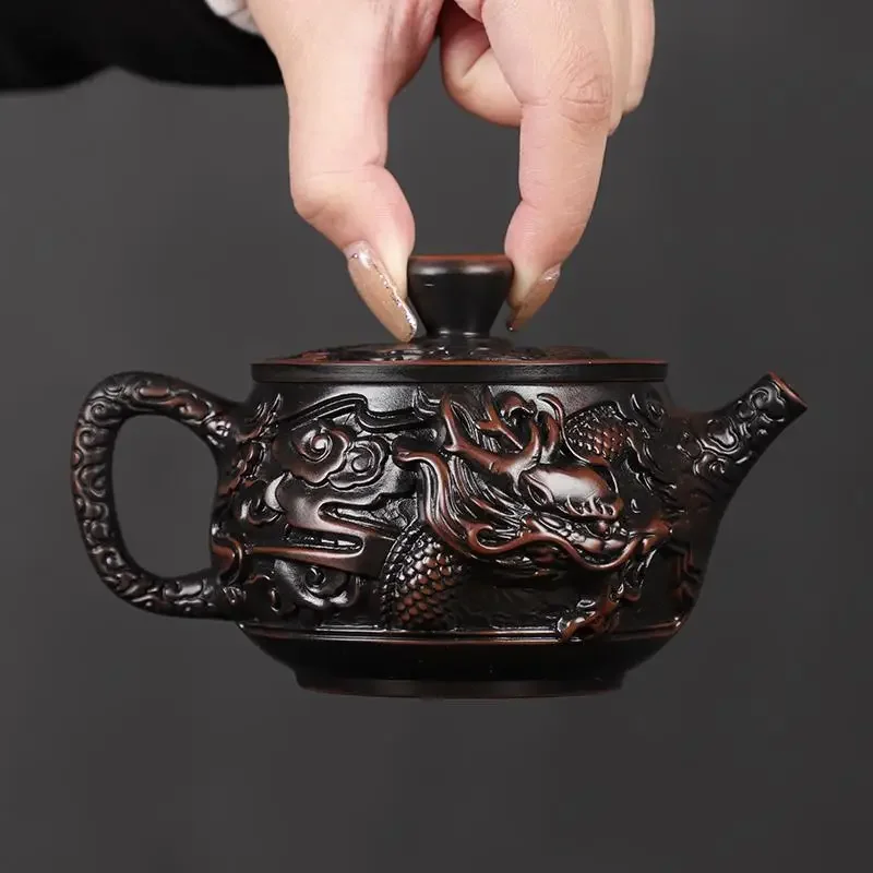 Rotating upside-down aircraft kettle fully carved handmade purple pottery teapot Kung Fu tea set Fengming kettle Xishi teapot